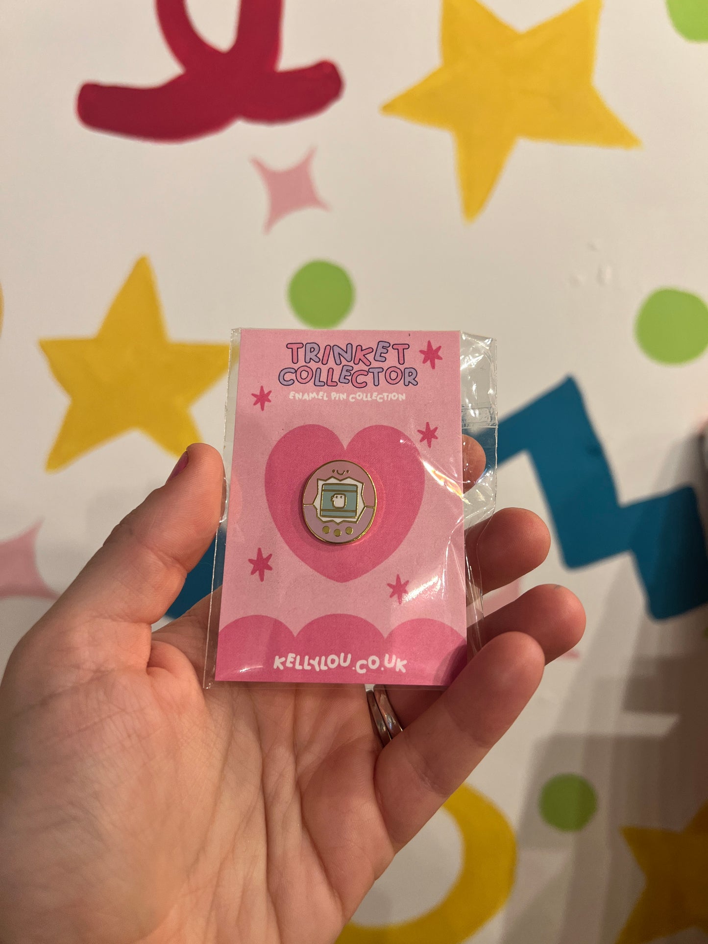 Virtual pet inspired enamel pin badge