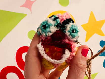 Mr Blobby themed crocheted keyring pouch for earphones