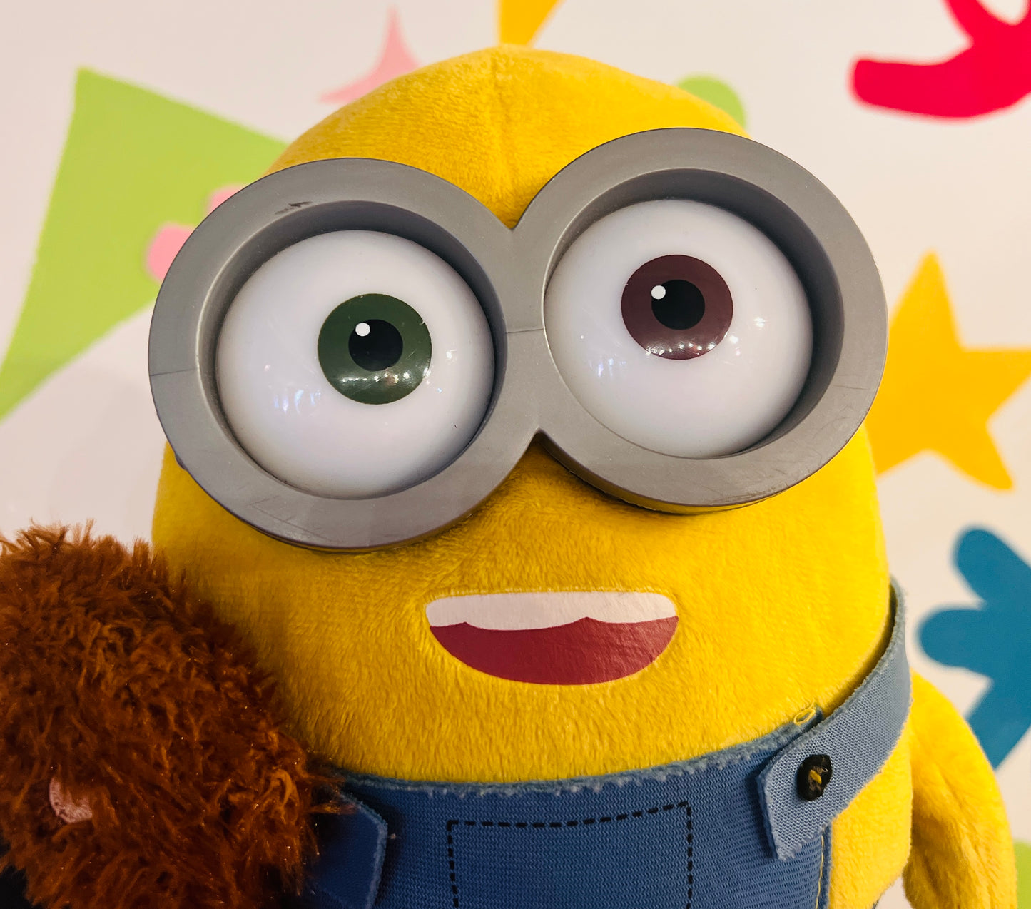 Minions plush toy holding teddy