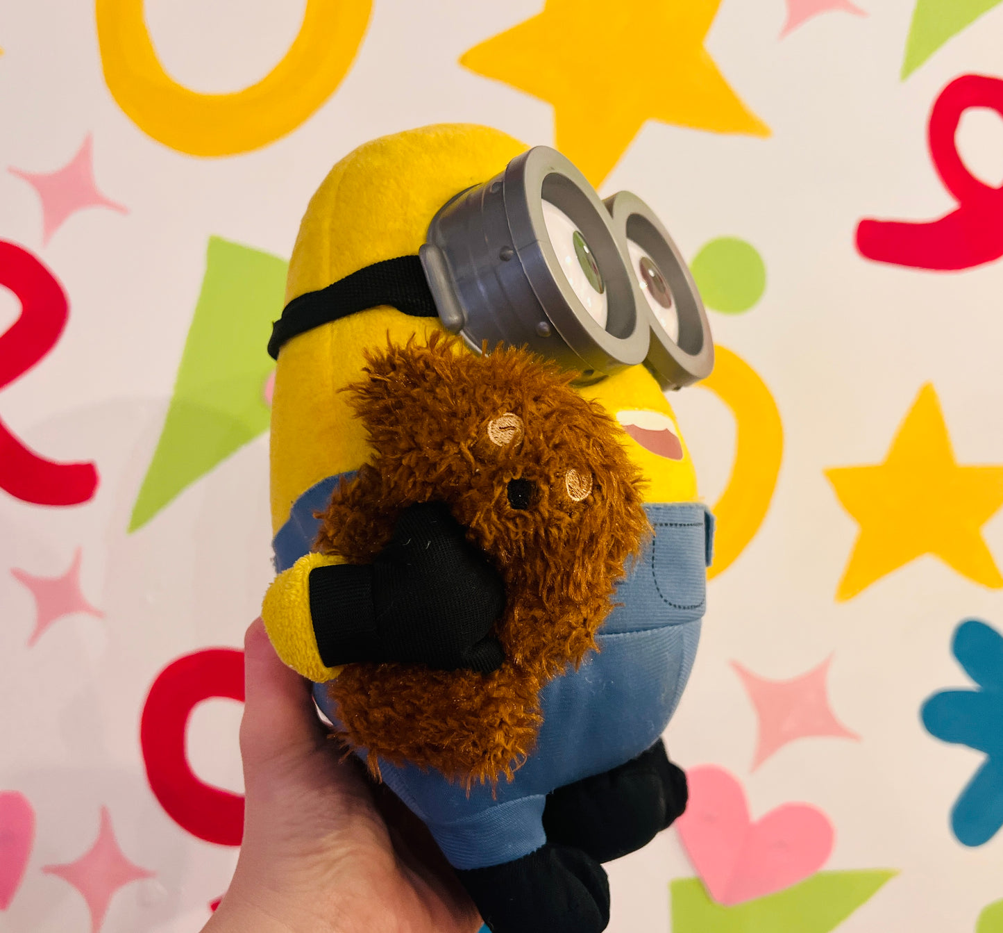 Minions plush toy holding teddy