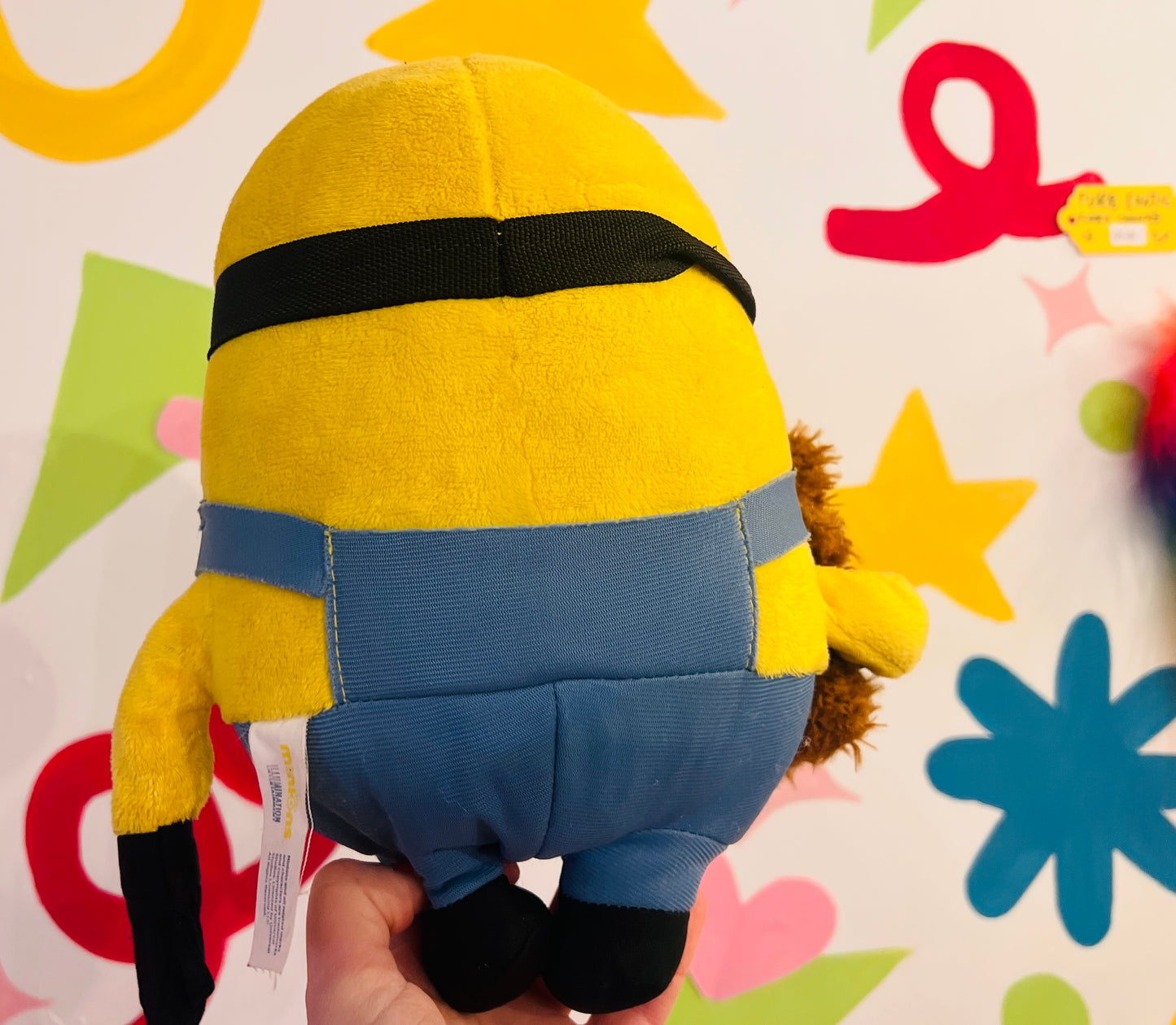 Minions plush toy holding teddy