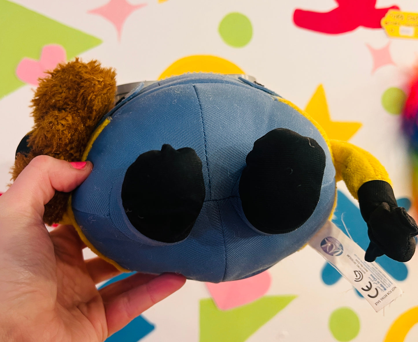 Minions plush toy holding teddy