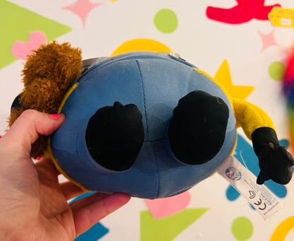 Minions plush toy holding teddy